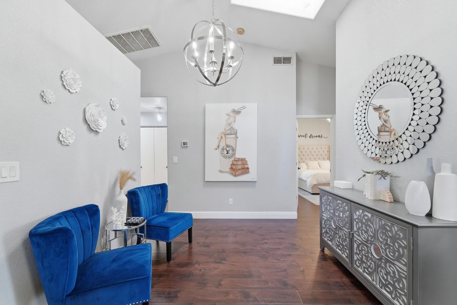 3409 Friar Tuck Way Modesto, CA 95355 - Photo 28 of 46 a living room with furniture a wall clock and a window