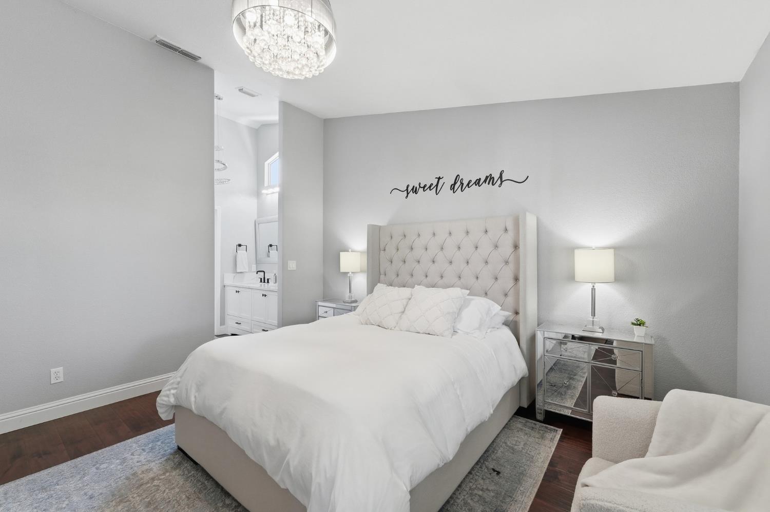 3409 Friar Tuck Way Modesto, CA 95355 - Photo 33 of 46 a bedroom with a bed and a chandelier