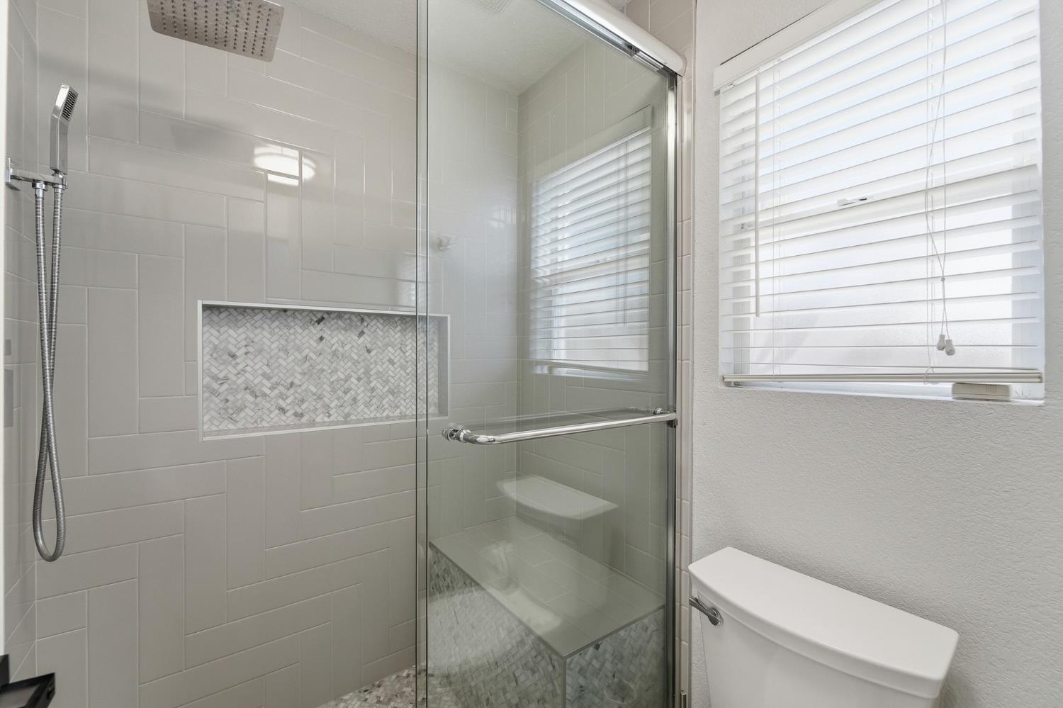 3409 Friar Tuck Way Modesto, CA 95355 - Photo 36 of 46 a bathroom with a toilet and a shower