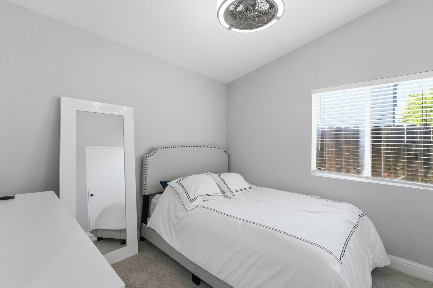 3409 Friar Tuck Way Modesto, CA 95355 - Photo 39 of 46 a bedroom with a bed and a window