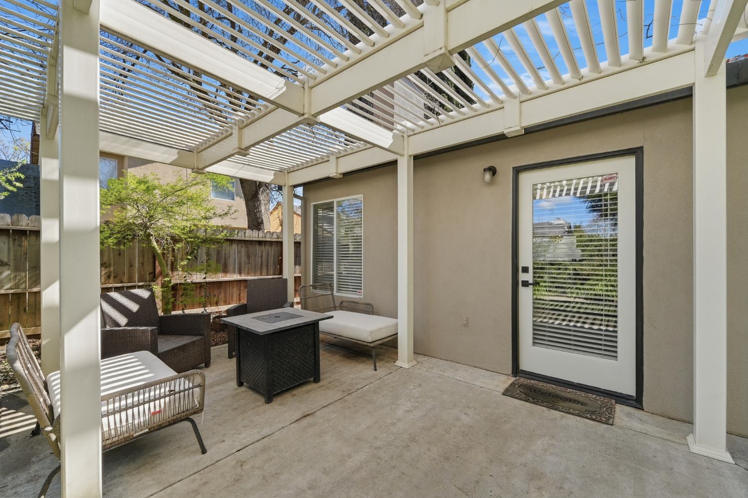 3409 Friar Tuck Way Modesto, CA 95355 - Photo 40 of 46 a view of a patio with couches and table and chairs with wooden floor and fence