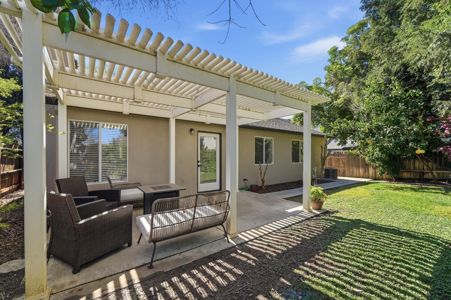 3409 Friar Tuck Way Modesto, CA 95355 - Photo 41 of 46 a view of a patio with couches table and chairs and potted plants