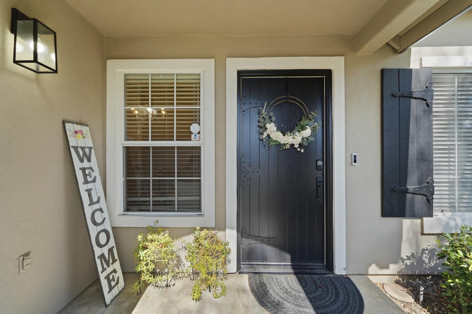 3409 Friar Tuck Way Modesto, CA 95355 - Photo 6 of 46 a front view of a house with wooden floor and a potted plant