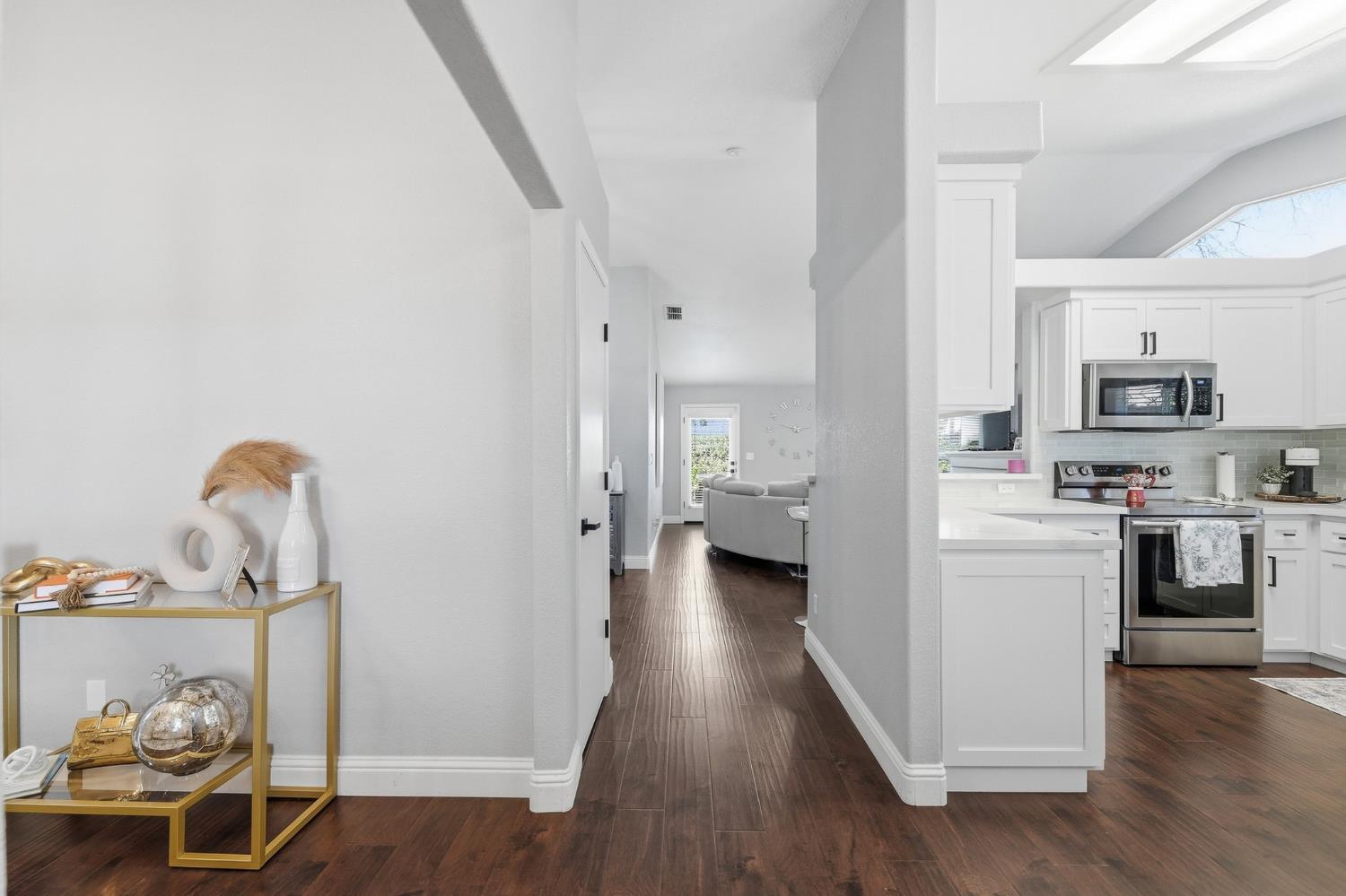 3409 Friar Tuck Way Modesto, CA 95355 - Photo 10 of 46 a kitchen with a refrigerator and a stove top oven