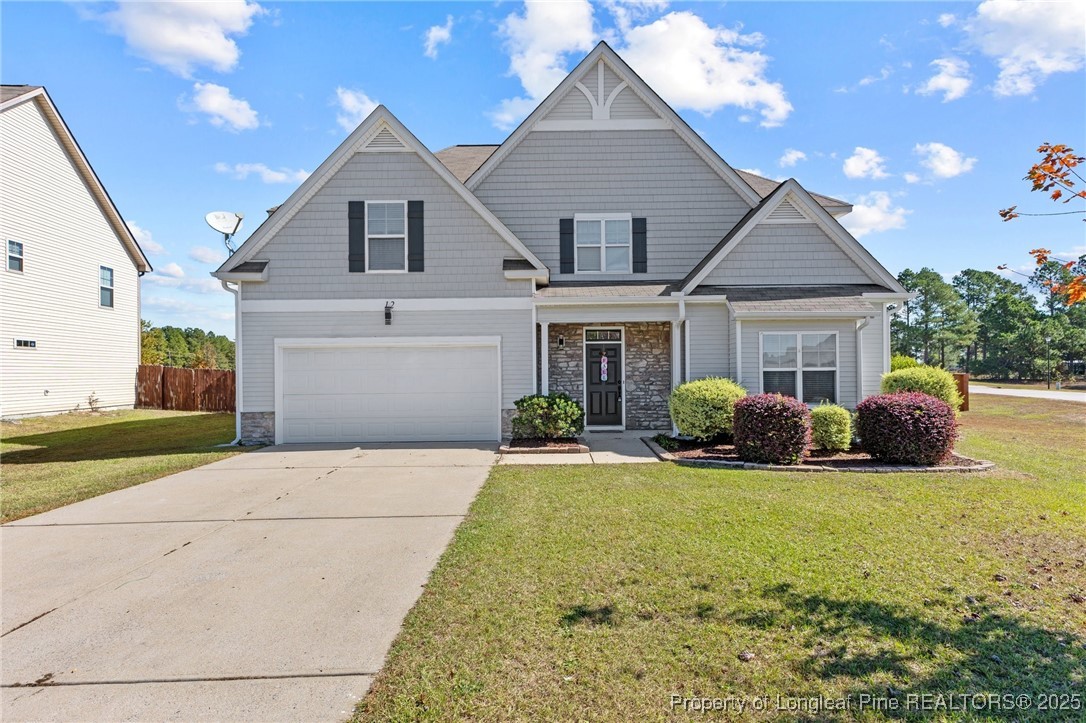 12 Turnbridge Way Spring Lake, NC 28390 - Photo 1 of 46 a view of a house with backyard and garden