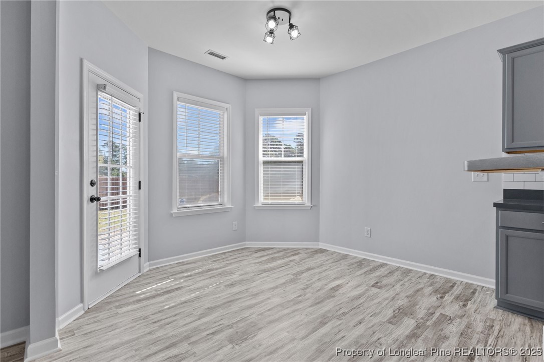 12 Turnbridge Way Spring Lake, NC 28390 - Photo 12 of 46 a view of empty room with wooden floor and fan