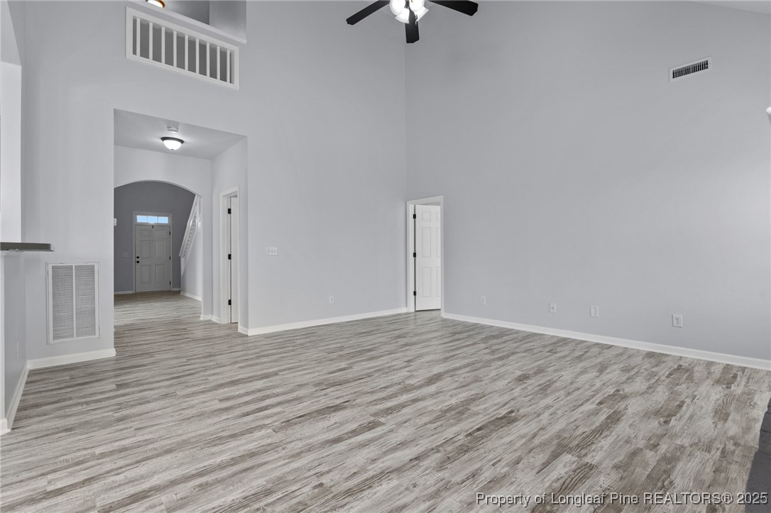 12 Turnbridge Way Spring Lake, NC 28390 - Photo 13 of 46 a view of an empty room with wooden floor and a ceiling fan