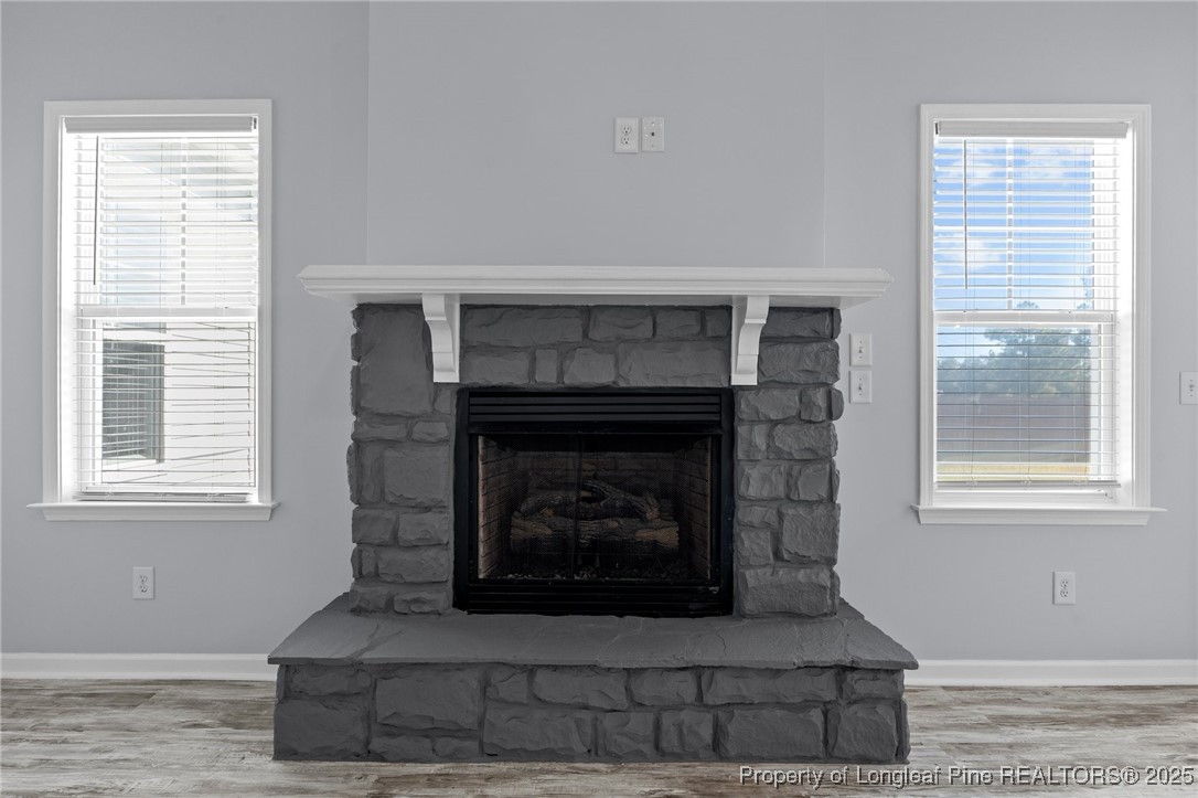 12 Turnbridge Way Spring Lake, NC 28390 - Photo 14 of 46 a living room with a fireplace and windows