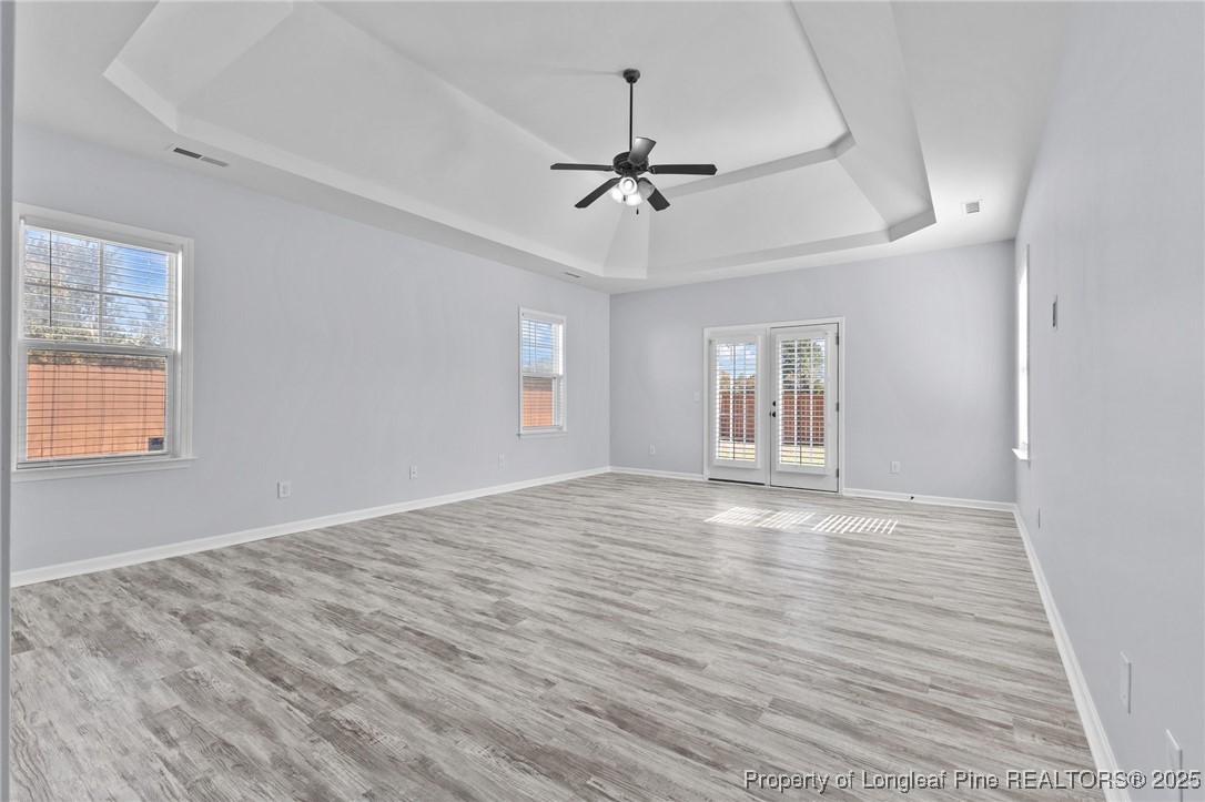 12 Turnbridge Way Spring Lake, NC 28390 - Photo 17 of 46 a view of an empty room with wooden floor and a window
