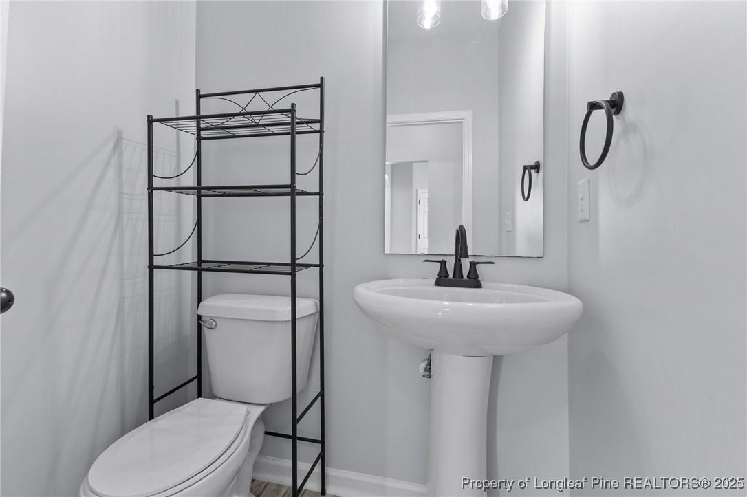 12 Turnbridge Way Spring Lake, NC 28390 - Photo 22 of 46 a bathroom with a sink toilet and shower