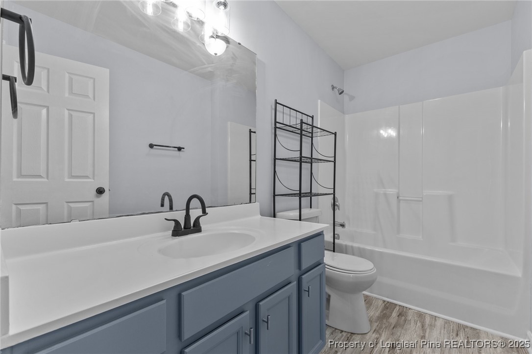 12 Turnbridge Way Spring Lake, NC 28390 - Photo 28 of 46 a bathroom with a sink a toilet and shower