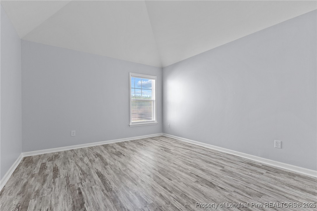 12 Turnbridge Way Spring Lake, NC 28390 - Photo 29 of 46 an empty room with wooden floor and windows