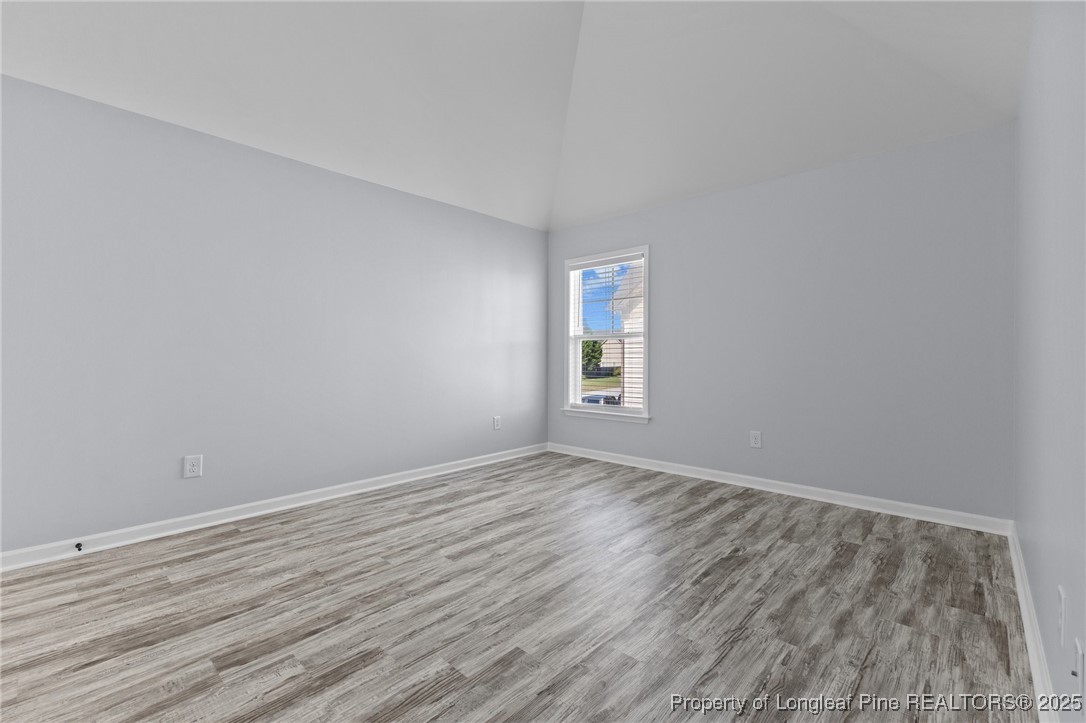 12 Turnbridge Way Spring Lake, NC 28390 - Photo 31 of 46 a view of an empty room with wooden floor and a window