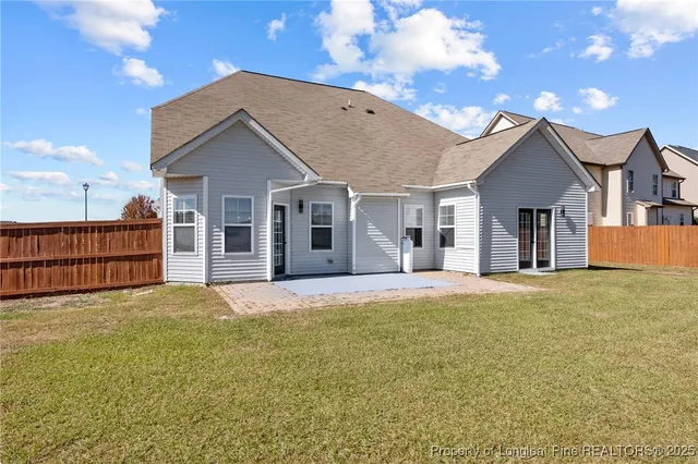 a view of a house with a yard and garage