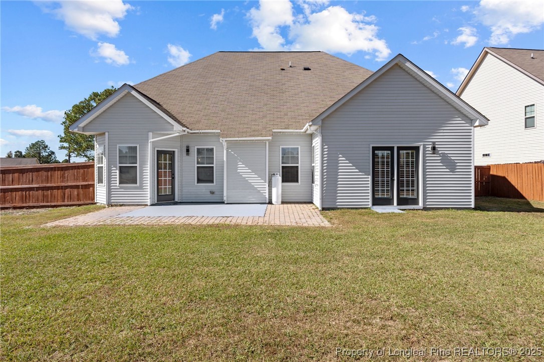 12 Turnbridge Way Spring Lake, NC 28390 - Photo 38 of 46 a view of a house with wooden floor and a yard