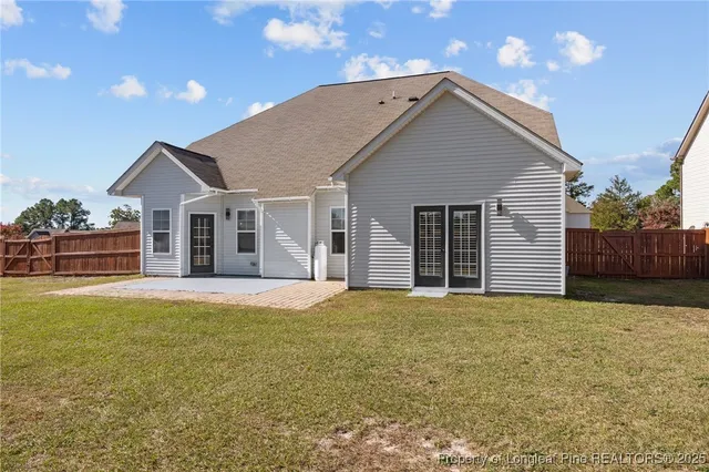 a front view of a house with yard and garage