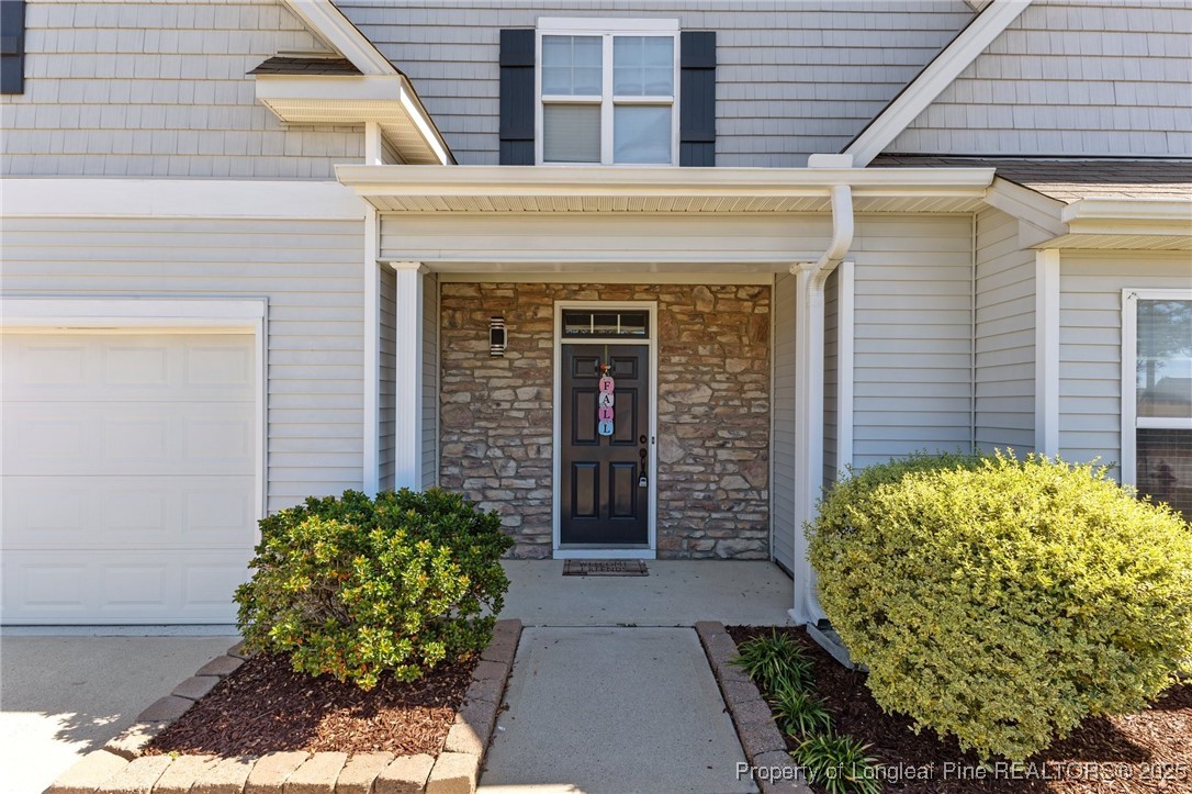 12 Turnbridge Way Spring Lake, NC 28390 - Photo 40 of 46 a front view of a house with garden