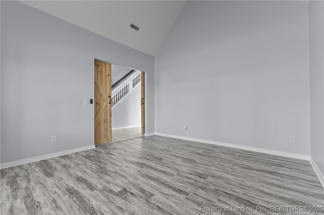 12 Turnbridge Way Spring Lake, NC 28390 - Photo 4 of 46 a view of an empty room with wooden floor and window