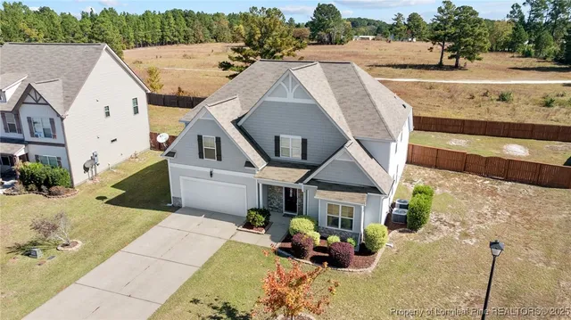 a aerial view of a house with a yard