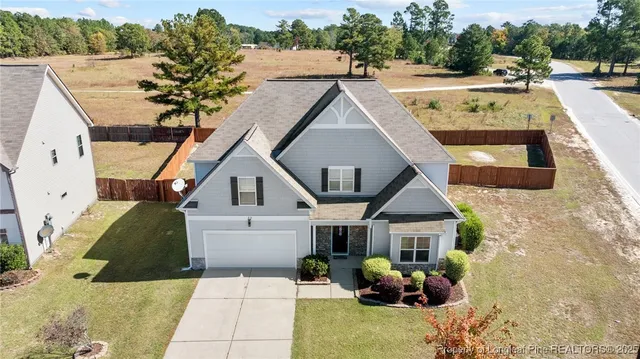 a aerial view of a house with swimming pool