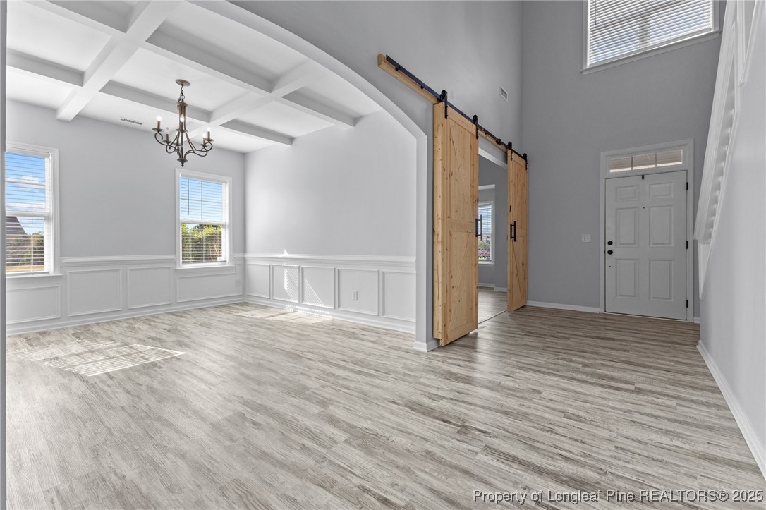 12 Turnbridge Way Spring Lake, NC 28390 - Photo 6 of 46 a view of an empty room with wooden floor and a window