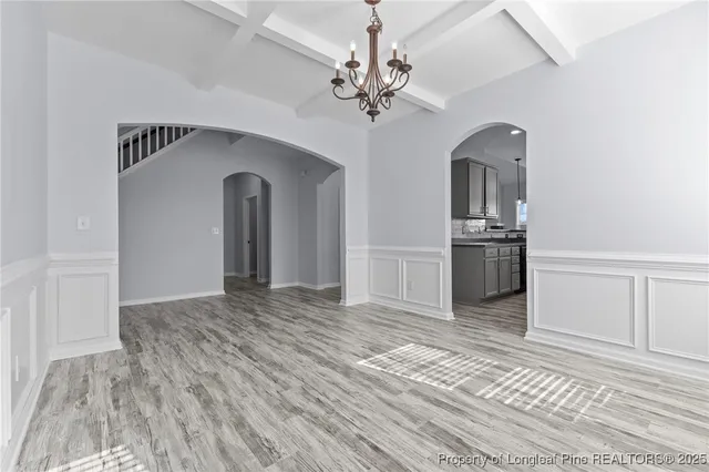 a view of a hallway with a kitchen