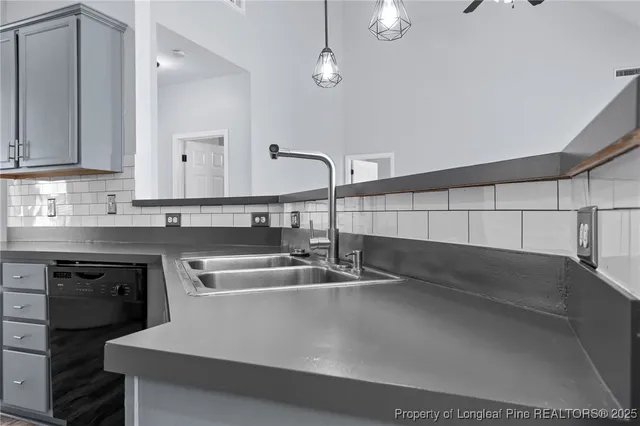 a kitchen with a sink and cabinets