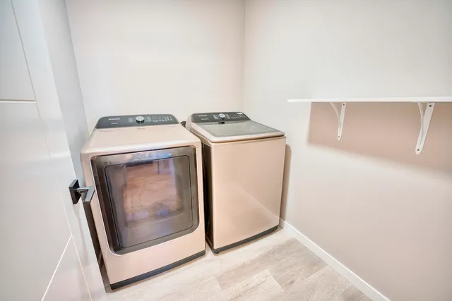 a utility room with dryer and washer
