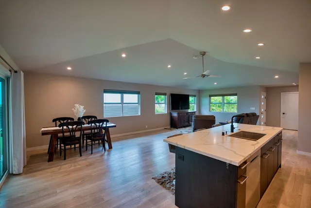 a kitchen with a table and chairs in it