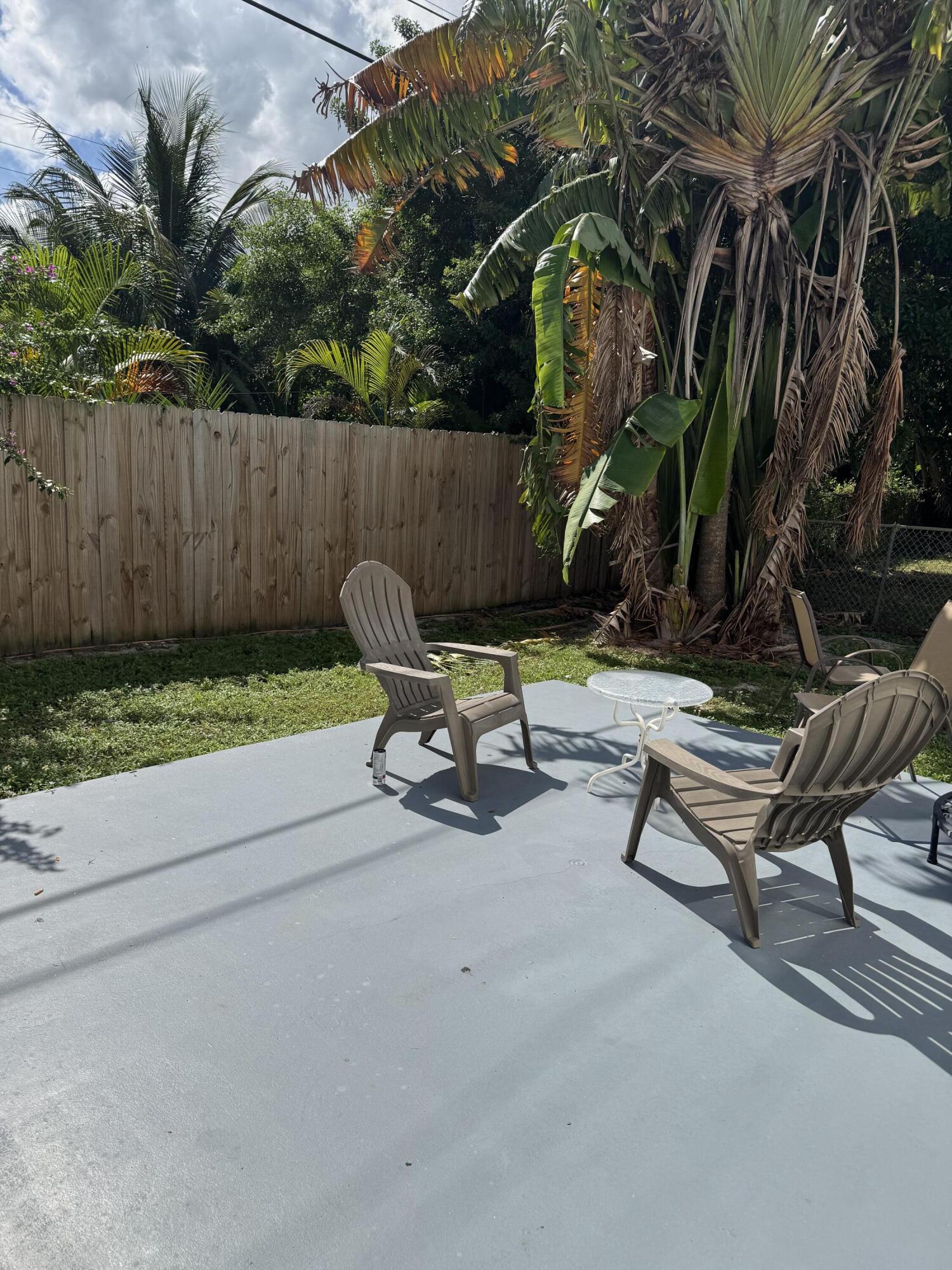 420 West Palm Street, Unit 4 Lantana, FL 33462 - Photo 19 of 21 a view of a backyard with sitting area