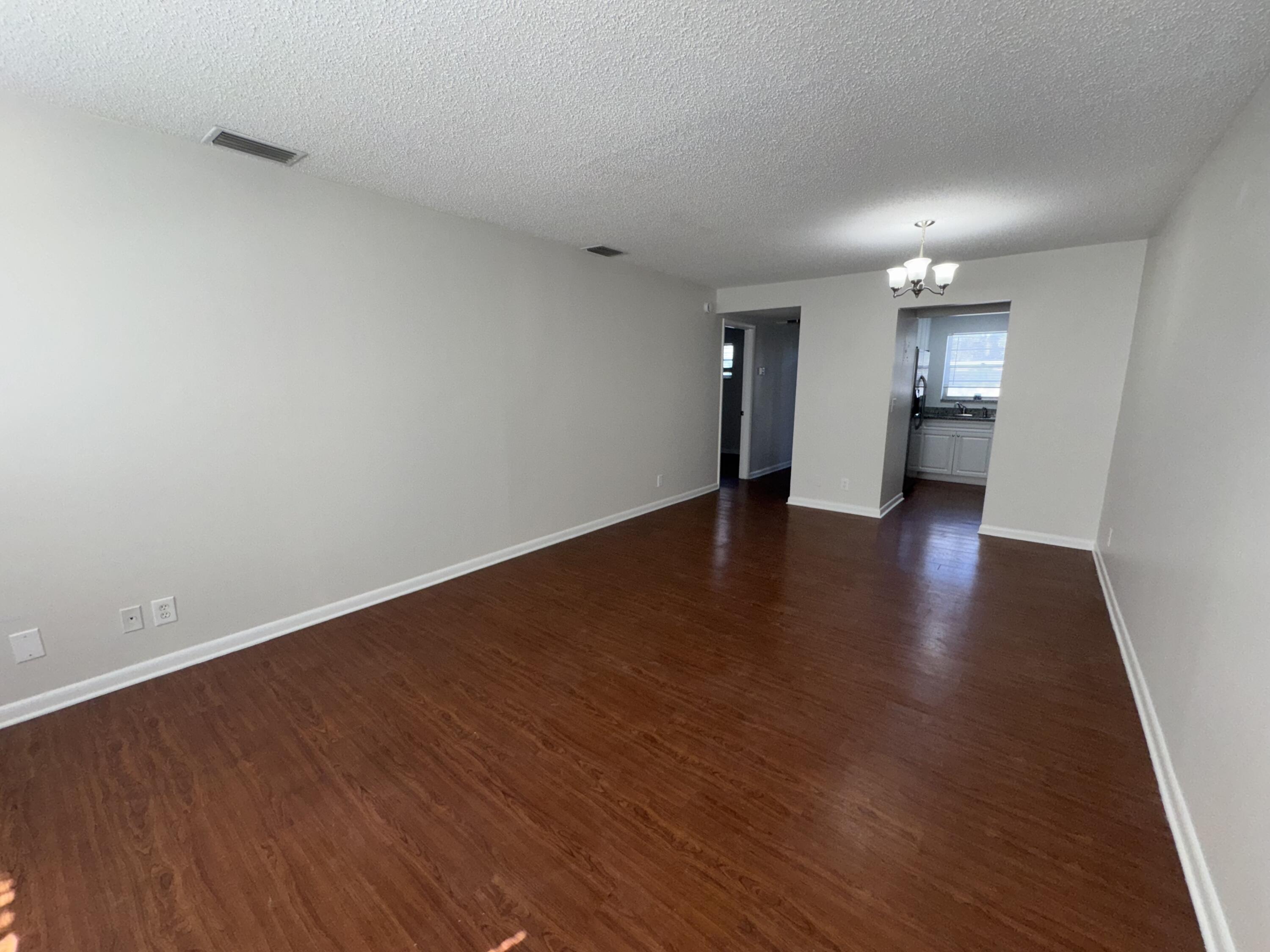 420 West Palm Street, Unit 4 Lantana, FL 33462 - Photo 5 of 21 a view of an empty room with wooden floor