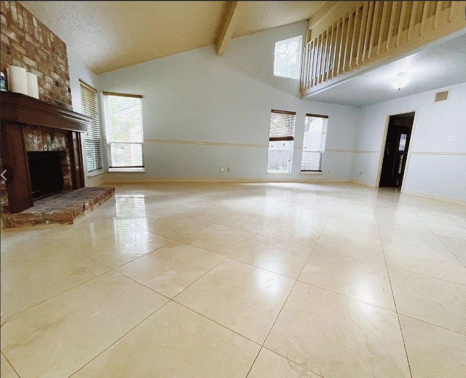 1906 Woodstream Boulevard Sugar Land, TX 77479 - Photo 3 of 14 a view of a livingroom with a fireplace