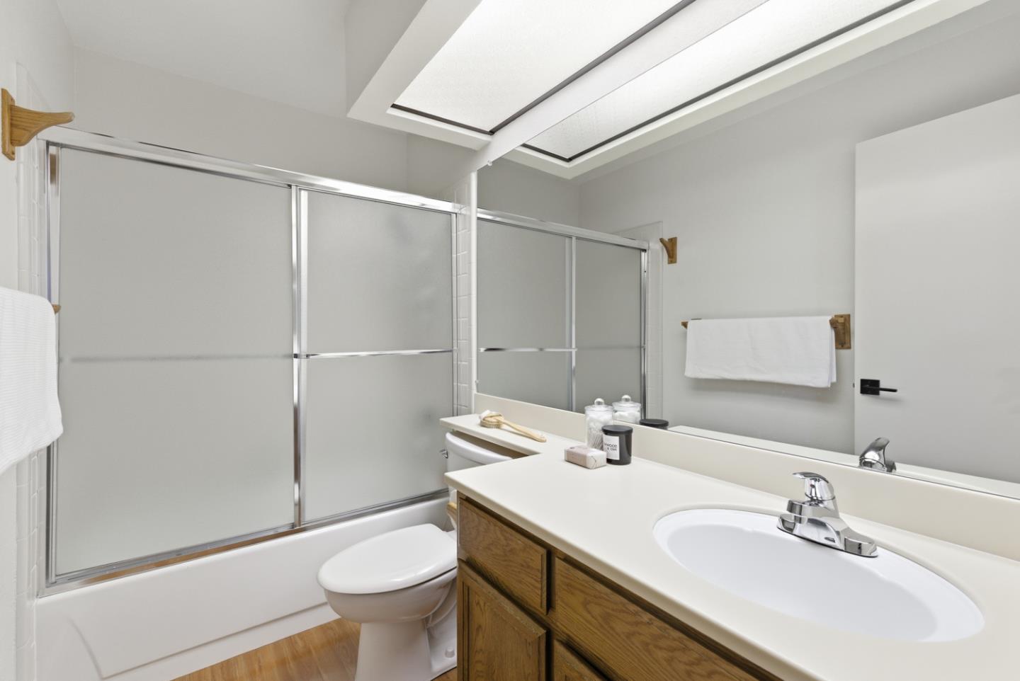 1669 Geary Road Walnut Creek, CA 94597 - Photo 35 of 39 a bathroom with a sink toilet and shower