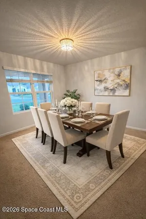 a view of a dining room with furniture