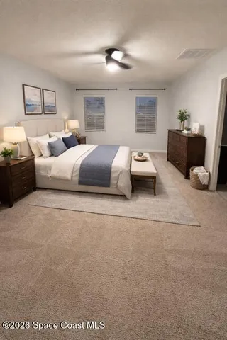 a bedroom with bed and furniture