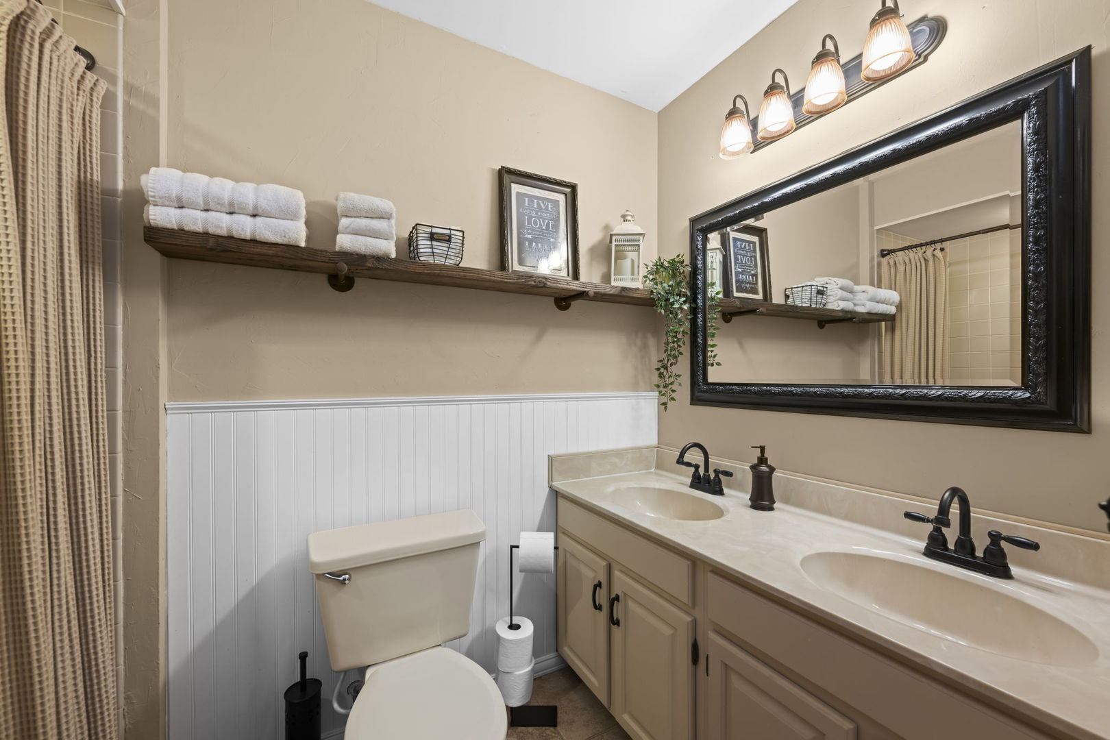 1565 Freeman Road Hoffman Estates, IL 60192 - Photo 28 of 46 a bathroom with a toilet sink and mirror