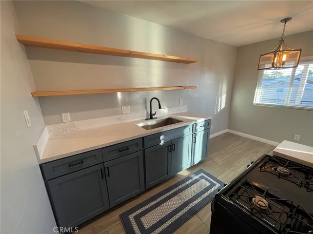 a kitchen with a stove and a sink
