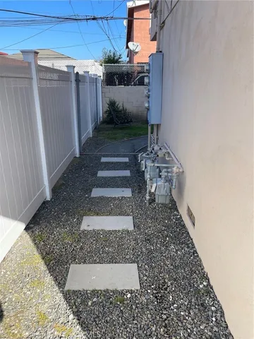 a view of a backyard with pathway