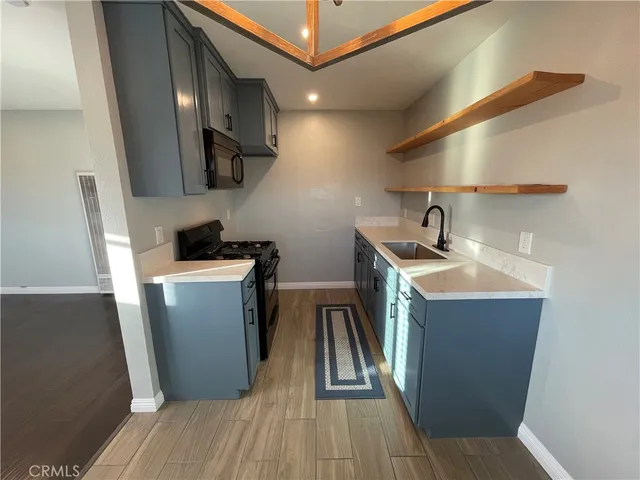 a utility room with sink dryer and washer