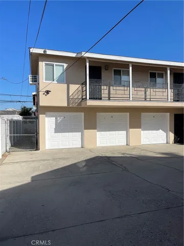 a front view of a house with garage