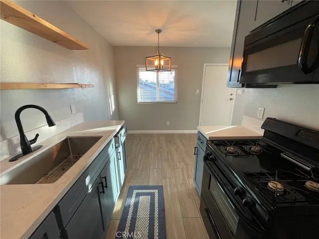 a kitchen with a stove and a microwave