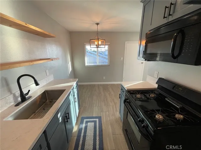a kitchen with a stove and a microwave