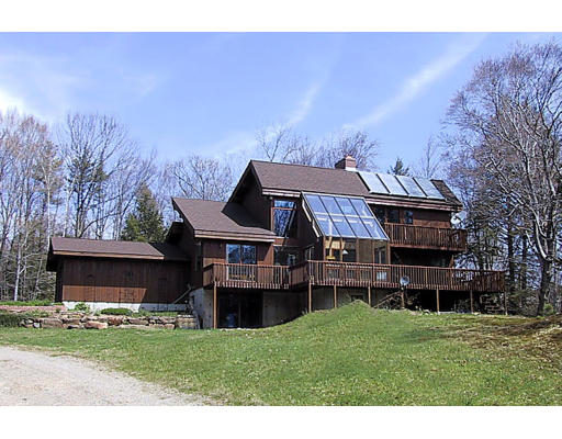28 Kruse Road Hubbardston, MA 01452 - Photo 1 of 7 a front view of a house with a garden