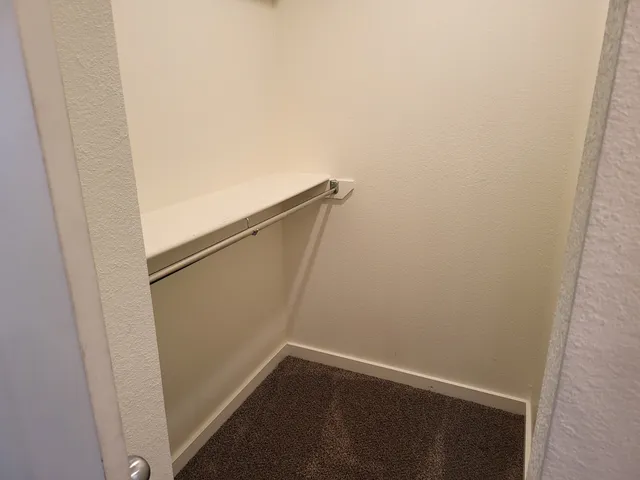 an empty room with a view of a bathroom