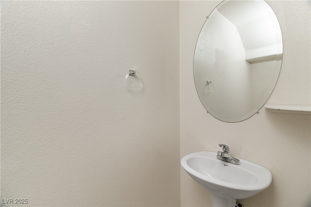 2715 Brinkley Manor Street Laughlin, NV 89029 - Photo 20 of 89 Hall Half Bathroom with a sink