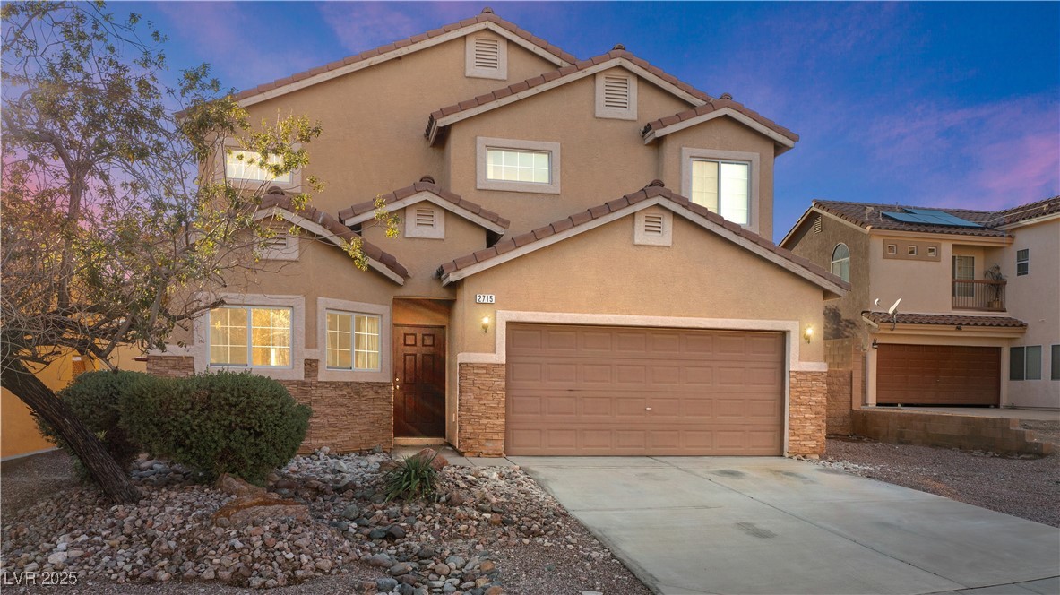 2715 Brinkley Manor Street Laughlin, NV 89029 - Photo 2 of 89 Mediterranean / spanish home featuring stone siding, driveway, and stucco siding