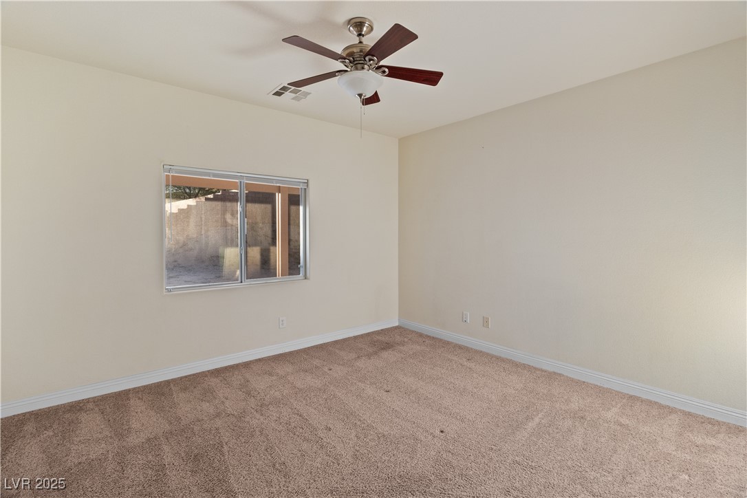 2715 Brinkley Manor Street Laughlin, NV 89029 - Photo 22 of 89 Primary Bedroom featuring light colored carpet and a ceiling fan