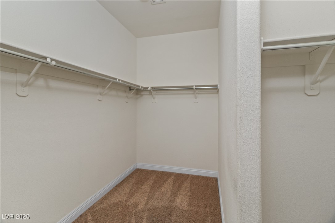 2715 Brinkley Manor Street Laughlin, NV 89029 - Photo 25 of 89 Spacious closet in Primary Bedroom with light colored carpet