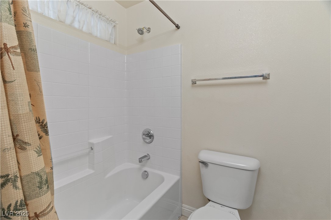 2715 Brinkley Manor Street Laughlin, NV 89029 - Photo 36 of 89 Full Jack-and-Jill style bathroom featuring shower / bathtub combination with curtain and toilet