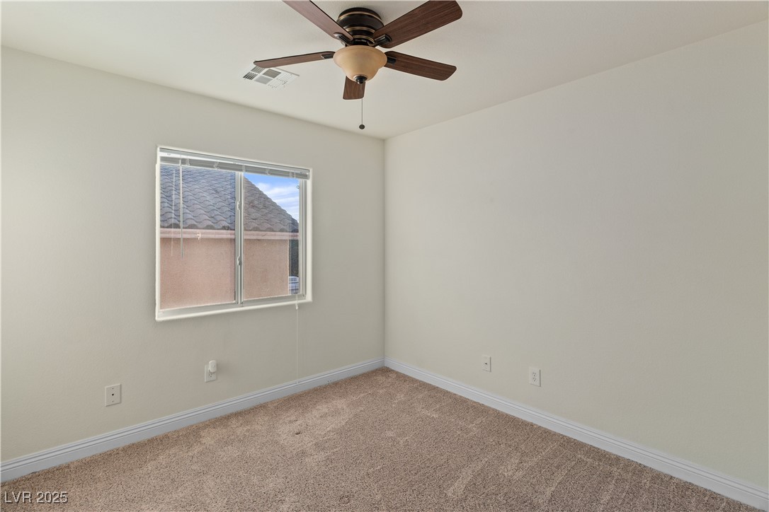 2715 Brinkley Manor Street Laughlin, NV 89029 - Photo 38 of 89 Carpeted Third Bedroom featuring baseboards and ceiling fan